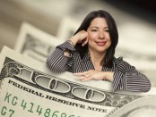 Attractive Hispanic Woman Leaning on a One Hundred Dollar Bill.